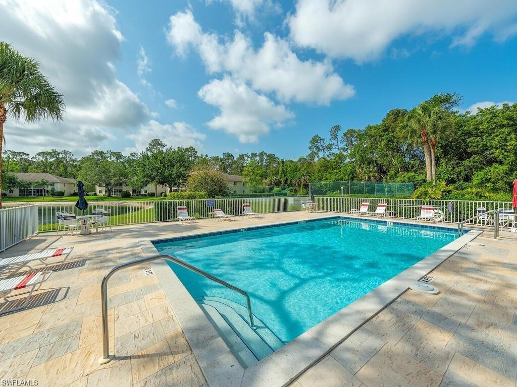280 Timber Lake Circle, Unit H201 Naples, FL 34104 - Photo 33 of 33 a view of a swimming pool with a lake view