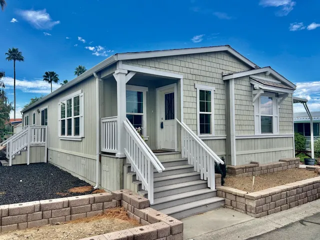 a front view of house with a yard