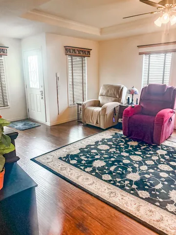 a living room with furniture rug and window