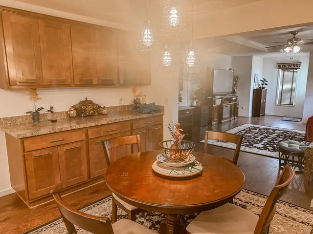 a kitchen with a dining table and chairs