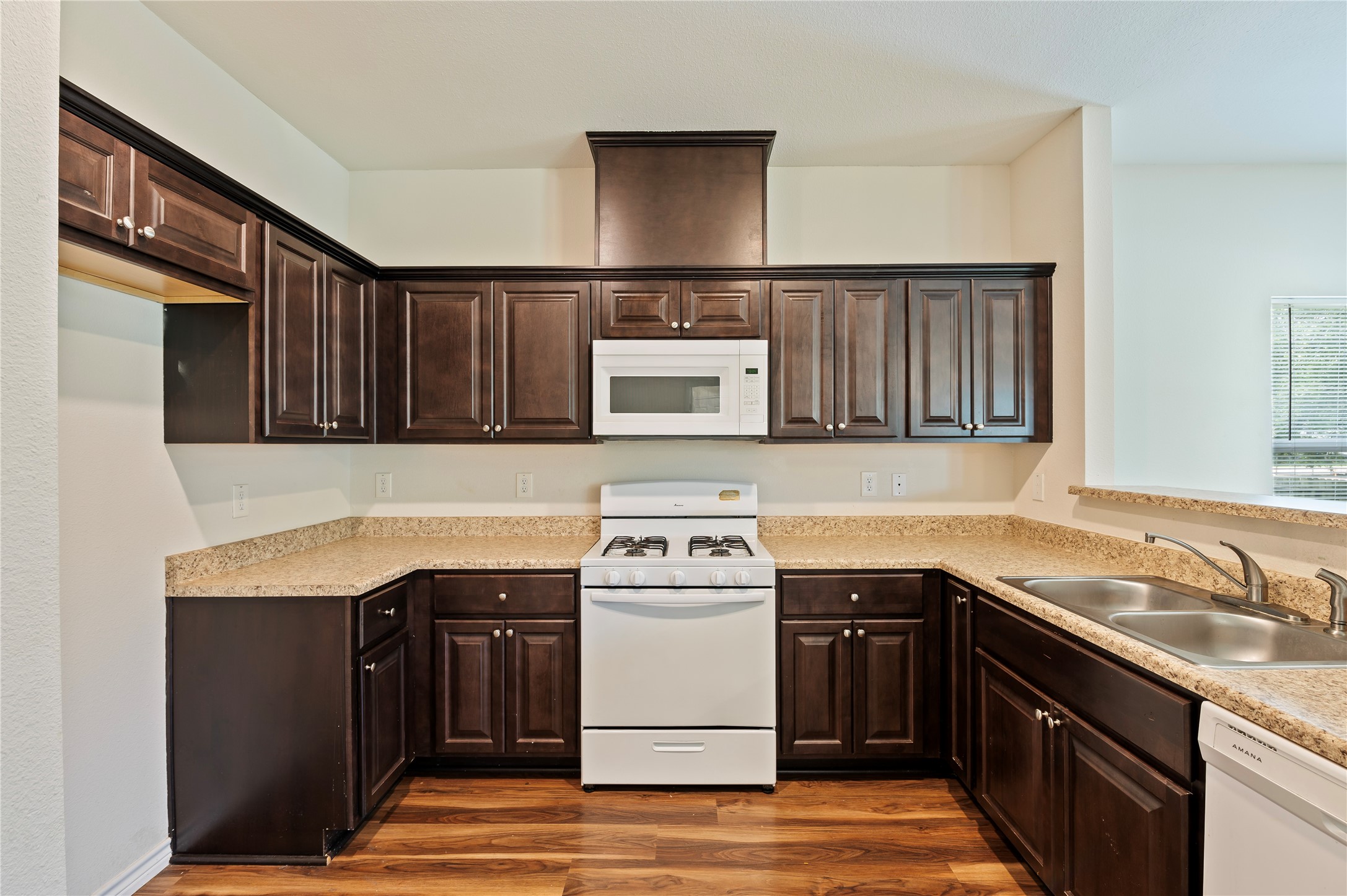 1125 Lake Road La Marque, TX 77568 - Photo 13 of 33 a kitchen with stainless steel appliances granite countertop a stove and a sink