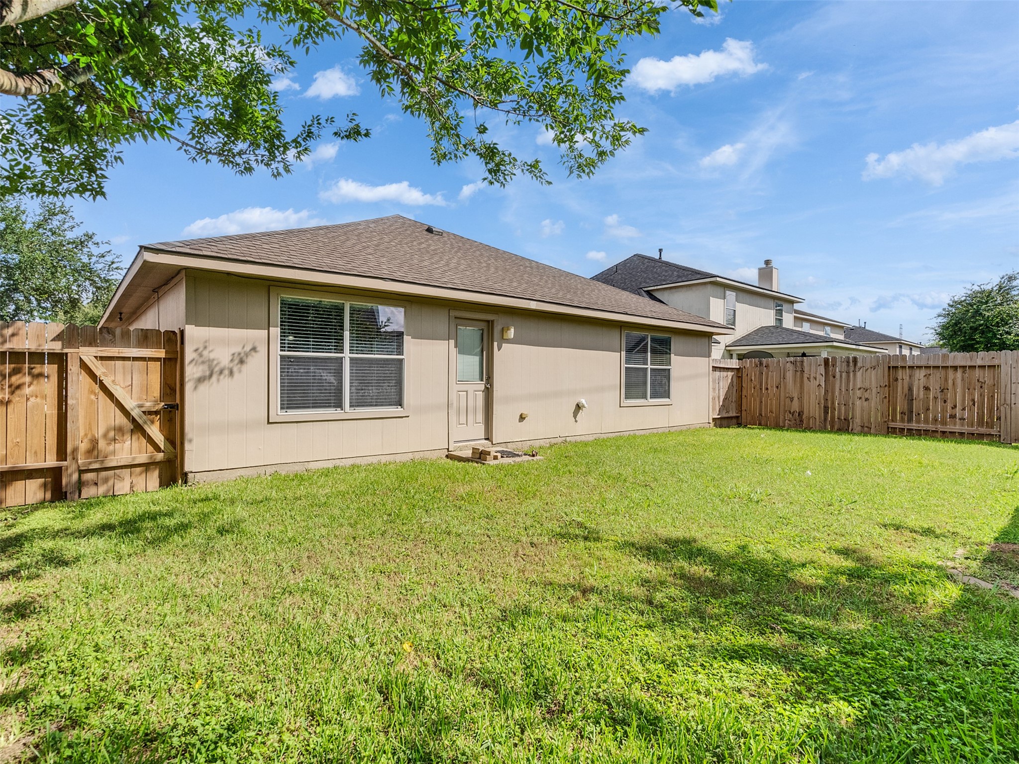 13431 Rural Oak Street Houston, TX 77034 - Photo 20 of 24 a front view of a house with yard and green space