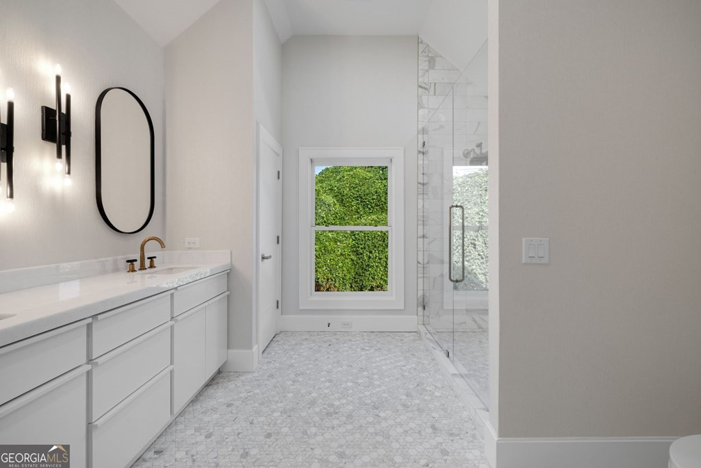 1281 East Main Street Blue Ridge, GA 30513 - Photo 16 of 19 a bathroom with a sink and mirror