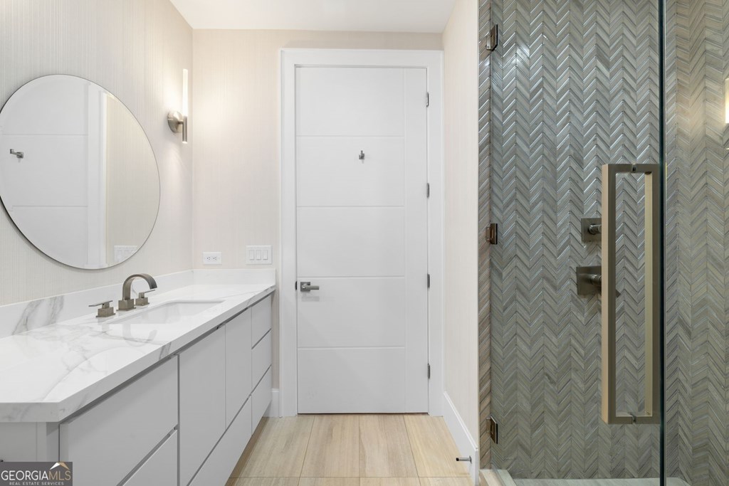 1281 East Main Street Blue Ridge, GA 30513 - Photo 4 of 19 a bathroom with a sink and a mirror