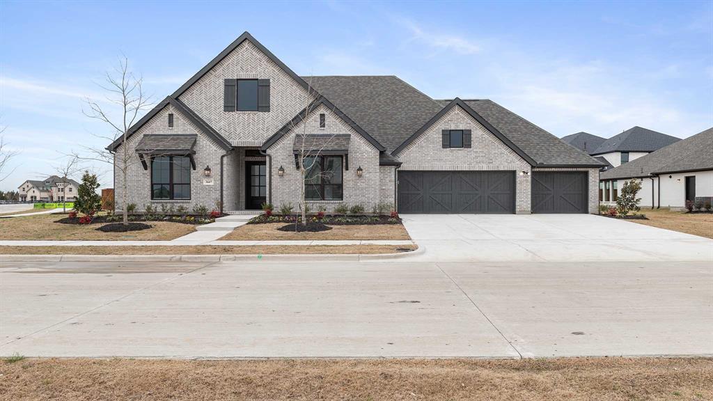 3607 Stableglen Drive Rockwall, TX 75032 - Photo 1 of 1 a front view of a house with a yard