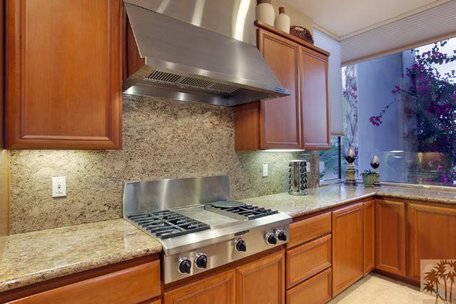 308 Loch Lomond Road Rancho Mirage, CA 92270 - Photo 13 of 25 a kitchen with granite countertop a stove and a sink