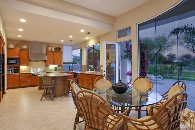 308 Loch Lomond Road Rancho Mirage, CA 92270 - Photo 10 of 25 a view of a dining room with furniture and chandelier