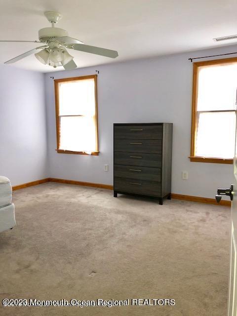 223 Lewis Street Oakhurst, NJ 07755 - Photo 12 of 12 an empty room with windows and closet
