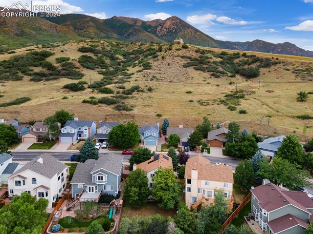 7730 Julynn Road Colorado Springs, CO 80919 - Photo 41 of 48 Drone / aerial view with a mountain view