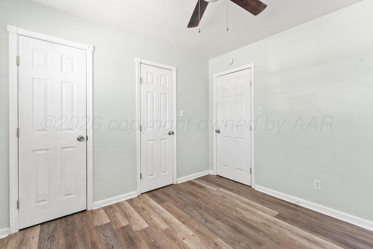 322 Poplar Street Amarillo, TX 79107 - Photo 13 of 42 wooden floor in an empty room
