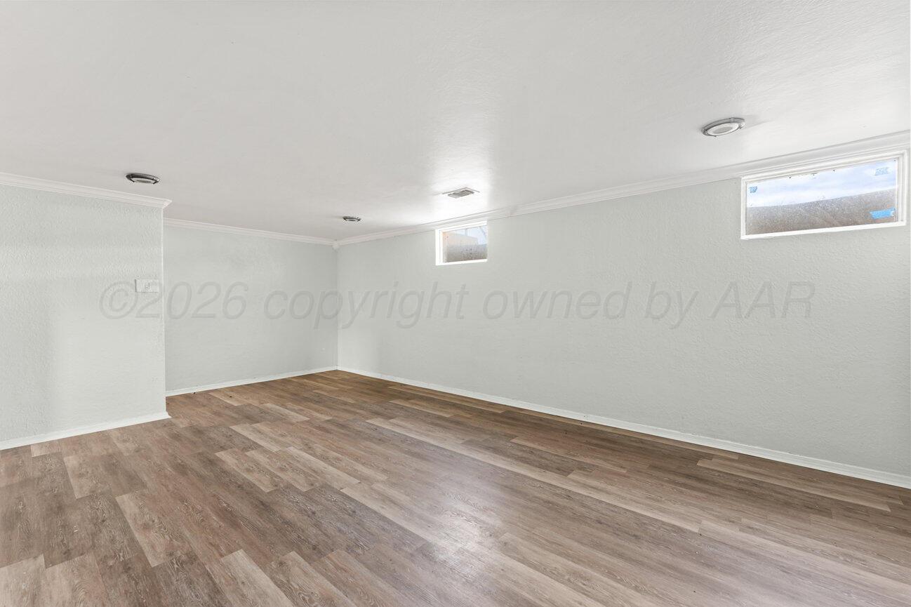 322 Poplar Street Amarillo, TX 79107 - Photo 25 of 42 a view of empty room with wooden floor