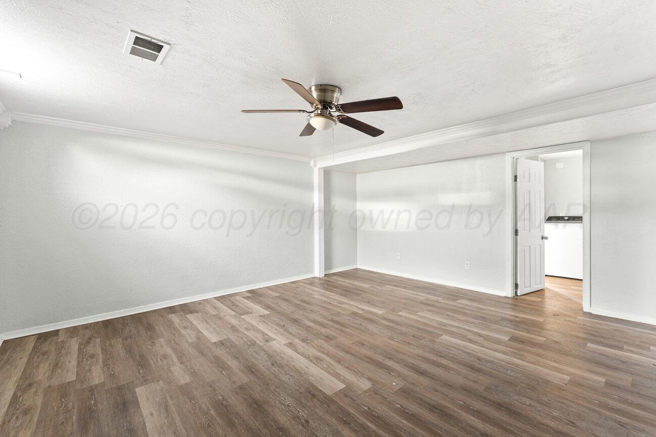 322 Poplar Street Amarillo, TX 79107 - Photo 32 of 42 wooden floor in an empty room