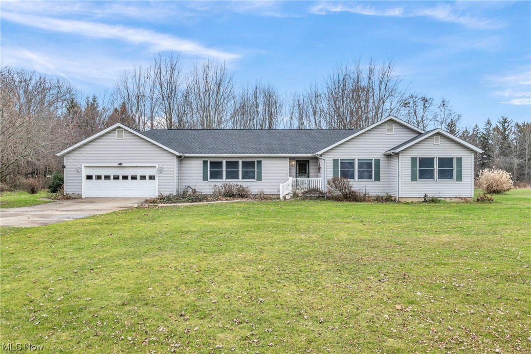 35808 Lorain Road North Ridgeville, OH 44039 - Photo 1 of 35 Ranch-style home featuring a front yard and a garage