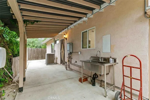 a view of house with outdoor seating space