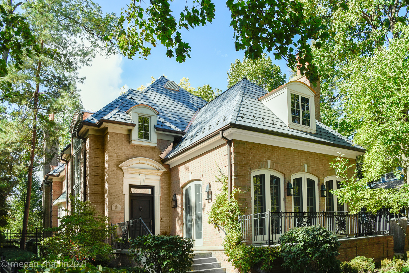 a front view of a house with garden