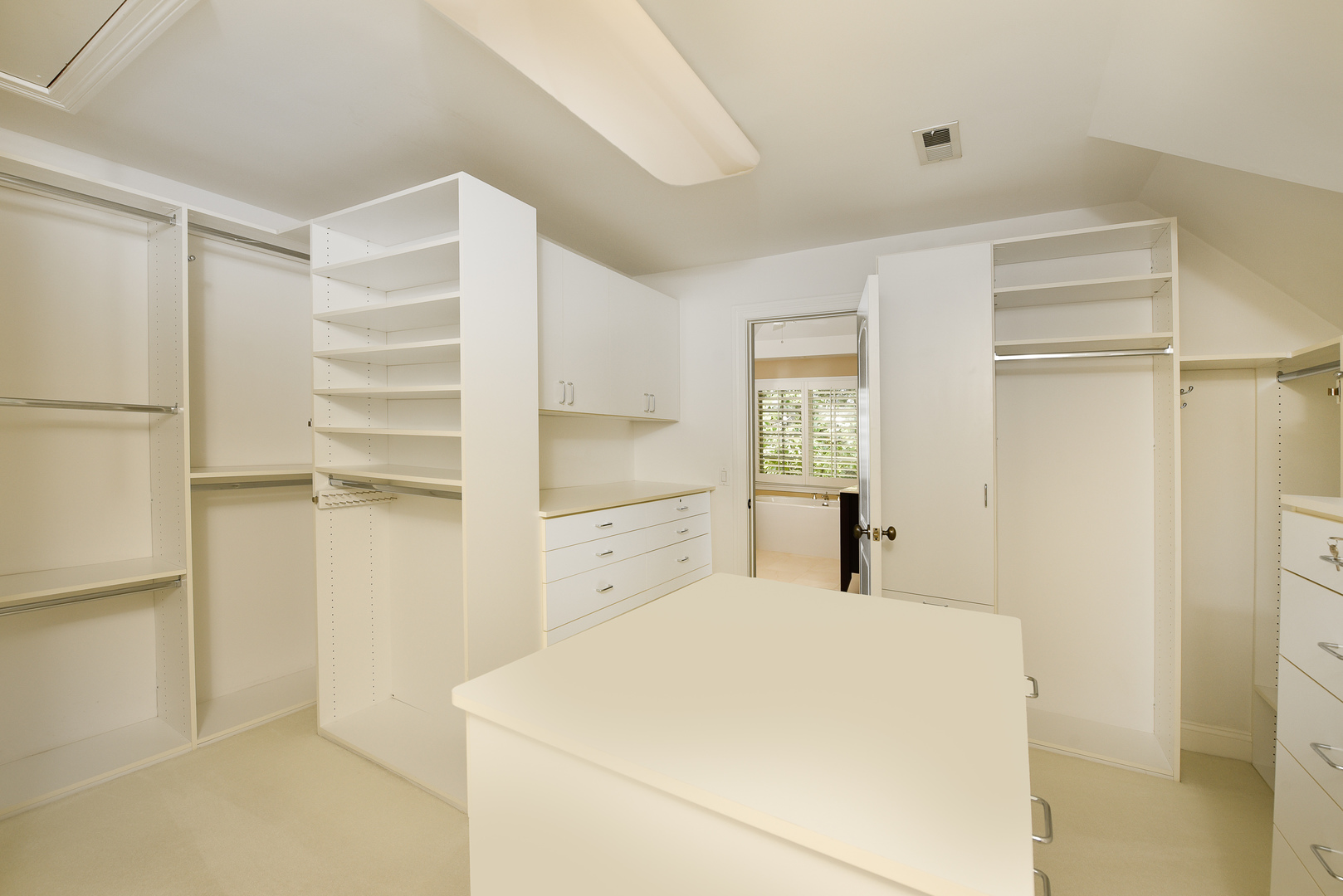 102 Church Road Winnetka, IL 60093 - Photo 27 of 46 a kitchen with a refrigerator and white cabinets