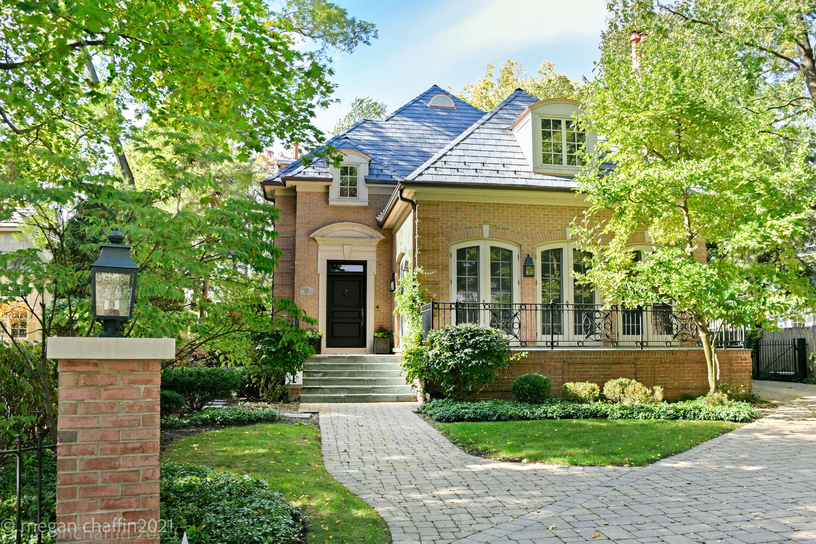 102 Church Road Winnetka, IL 60093 - Photo 46 of 46 a front view of a house with garden