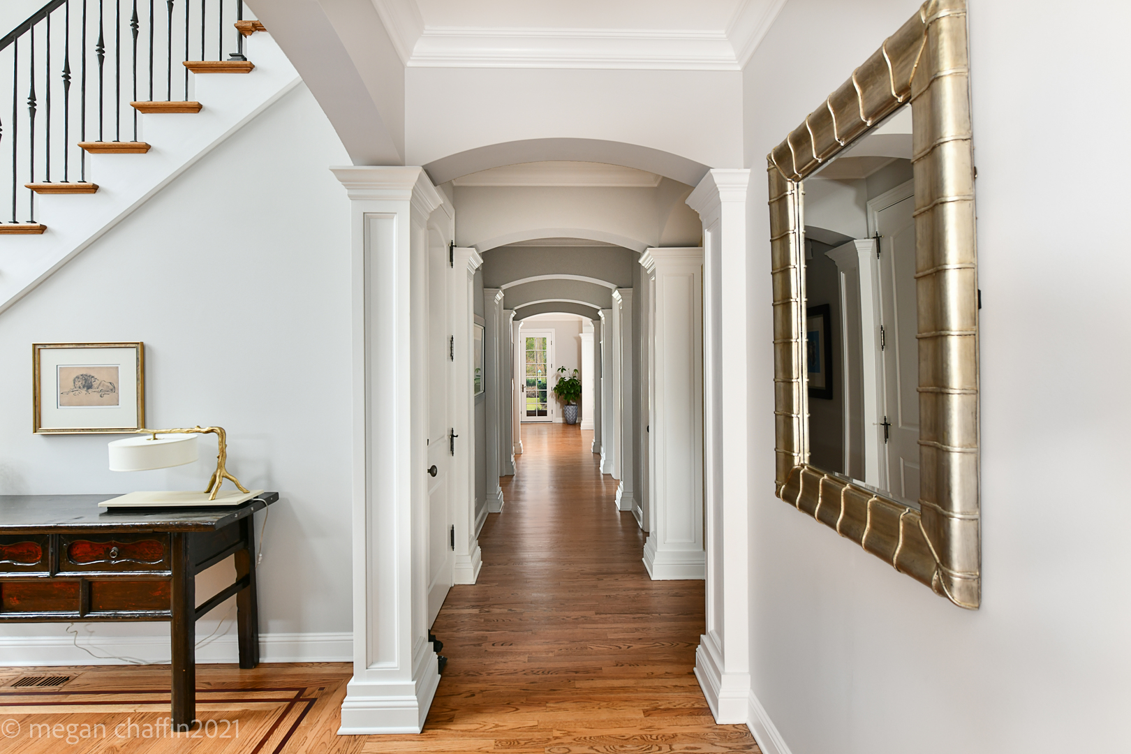 102 Church Road Winnetka, IL 60093 - Photo 9 of 46 a view of a hallway with wooden floor and staircase
