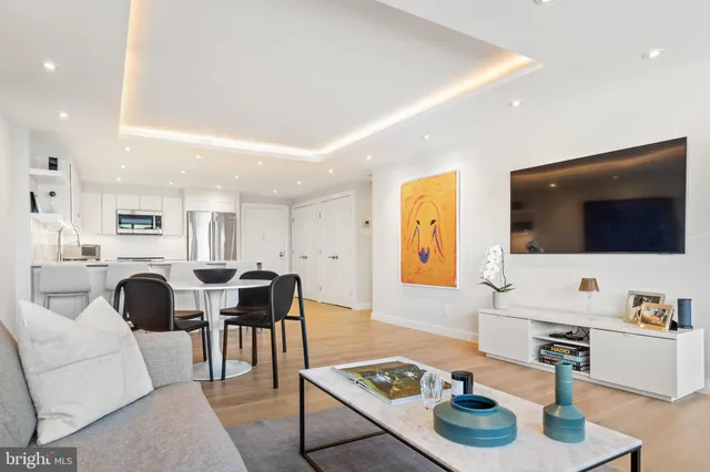 a bedroom with a bed and a desk