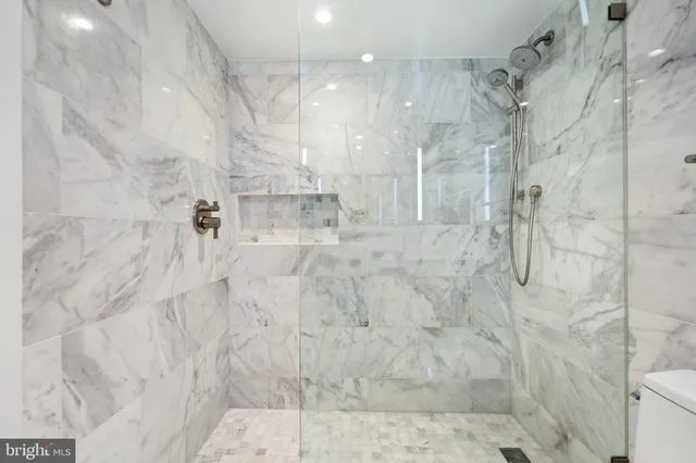 a close view of a utility room with dryer and washer
