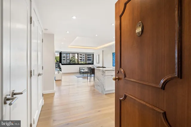 a kitchen with a refrigerator and a stove top oven