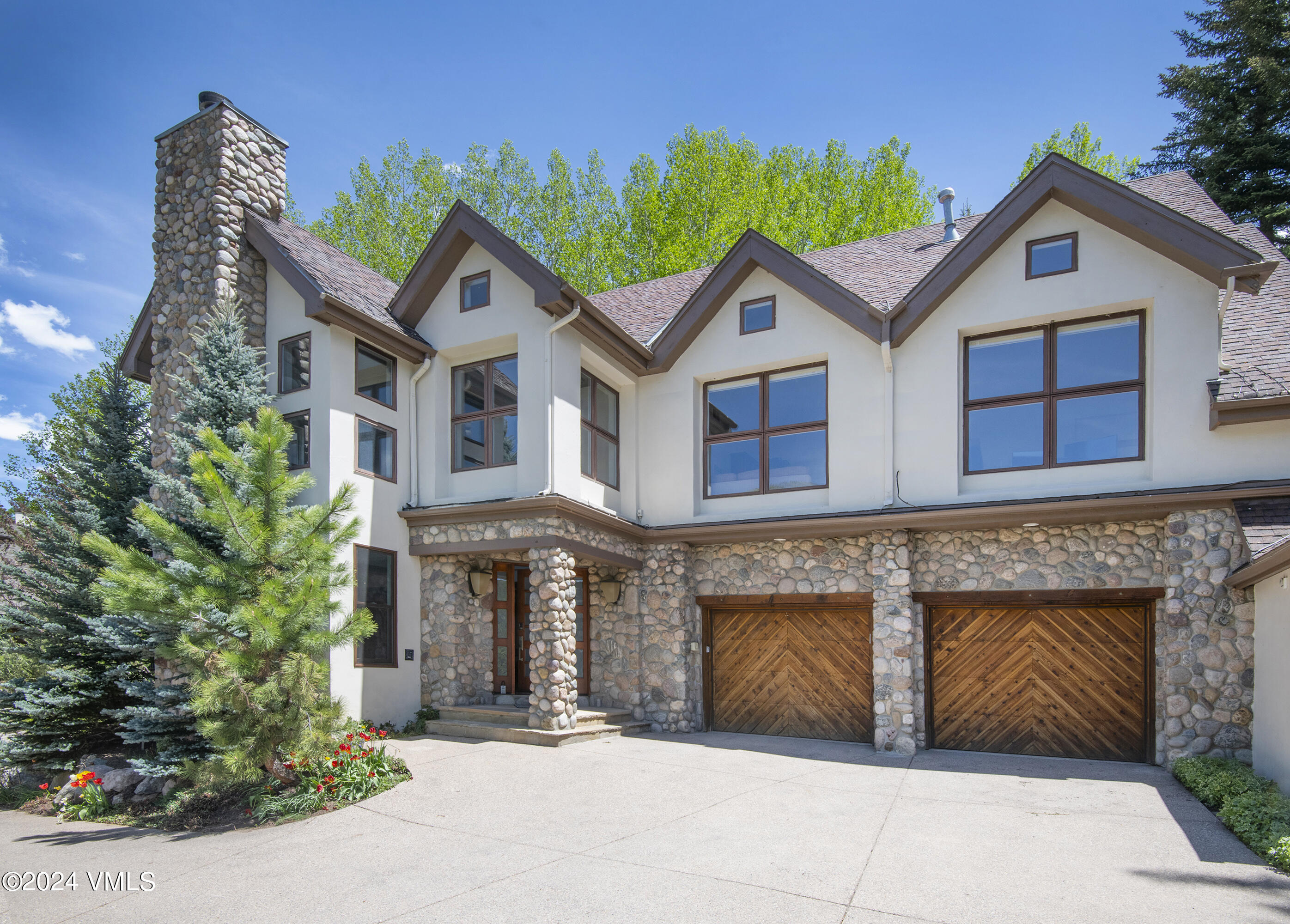 a front view of a house with yard