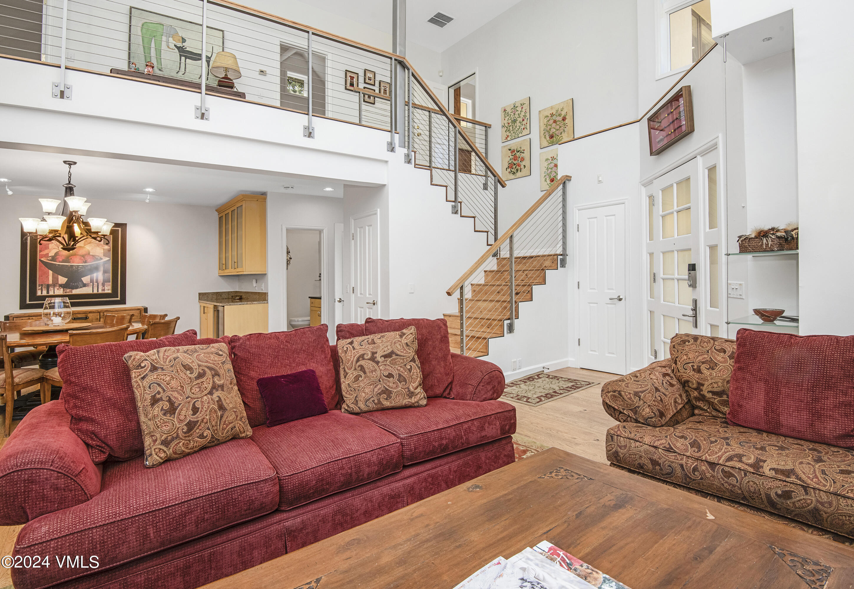 1968 Vermont Road Vail, CO 81657 - Photo 11 of 69 a view of living room filled with furniture and a chandelier