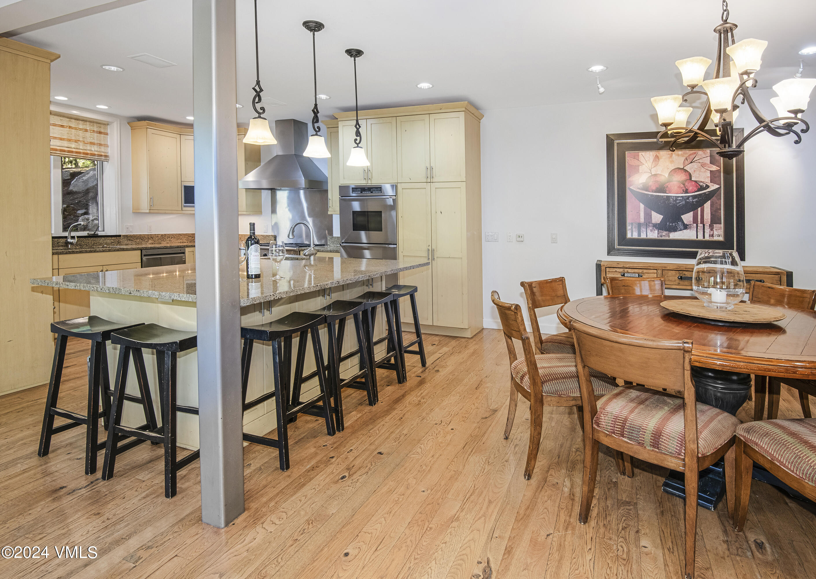 1968 Vermont Road Vail, CO 81657 - Photo 13 of 69 a view of a dining room with furniture and wooden floor