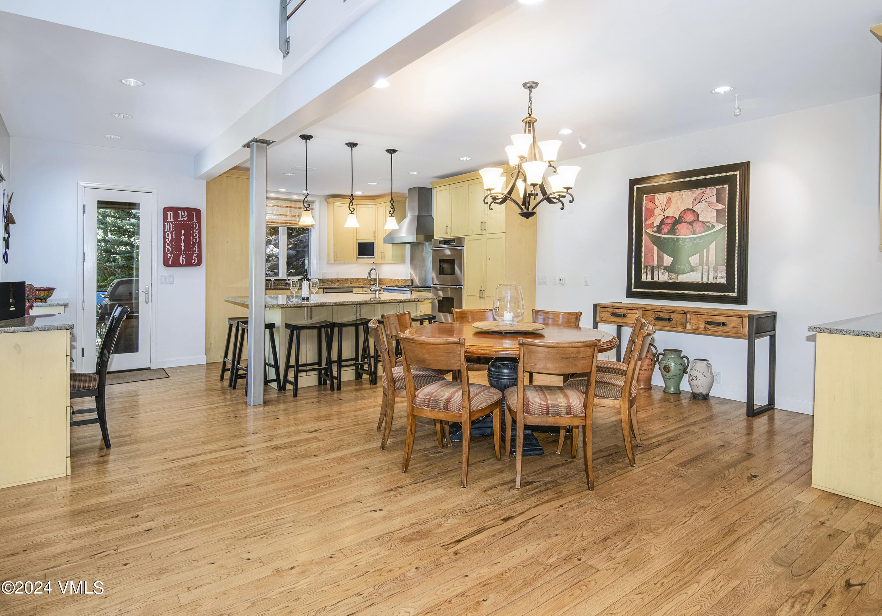 1968 Vermont Road Vail, CO 81657 - Photo 14 of 69 a view of a dining room with furniture and wooden floor