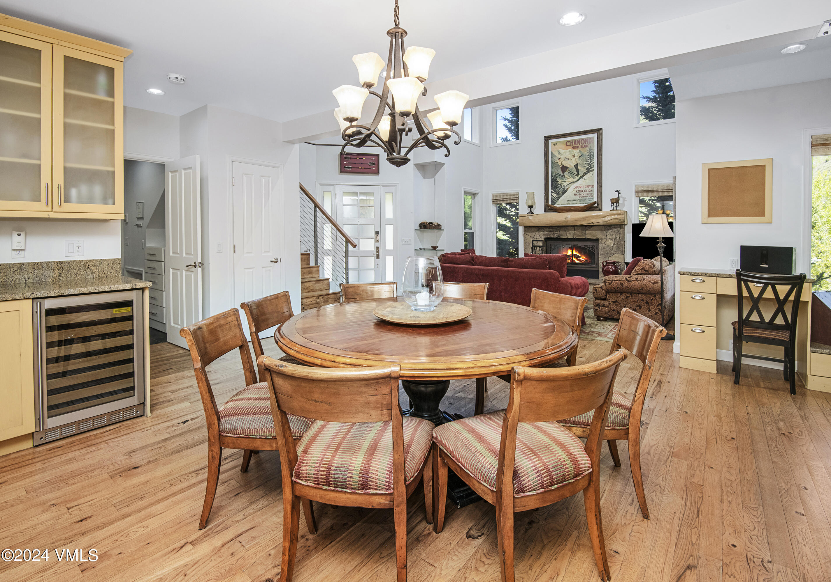 1968 Vermont Road Vail, CO 81657 - Photo 16 of 69 a dining room with furniture a chandelier and wooden floor