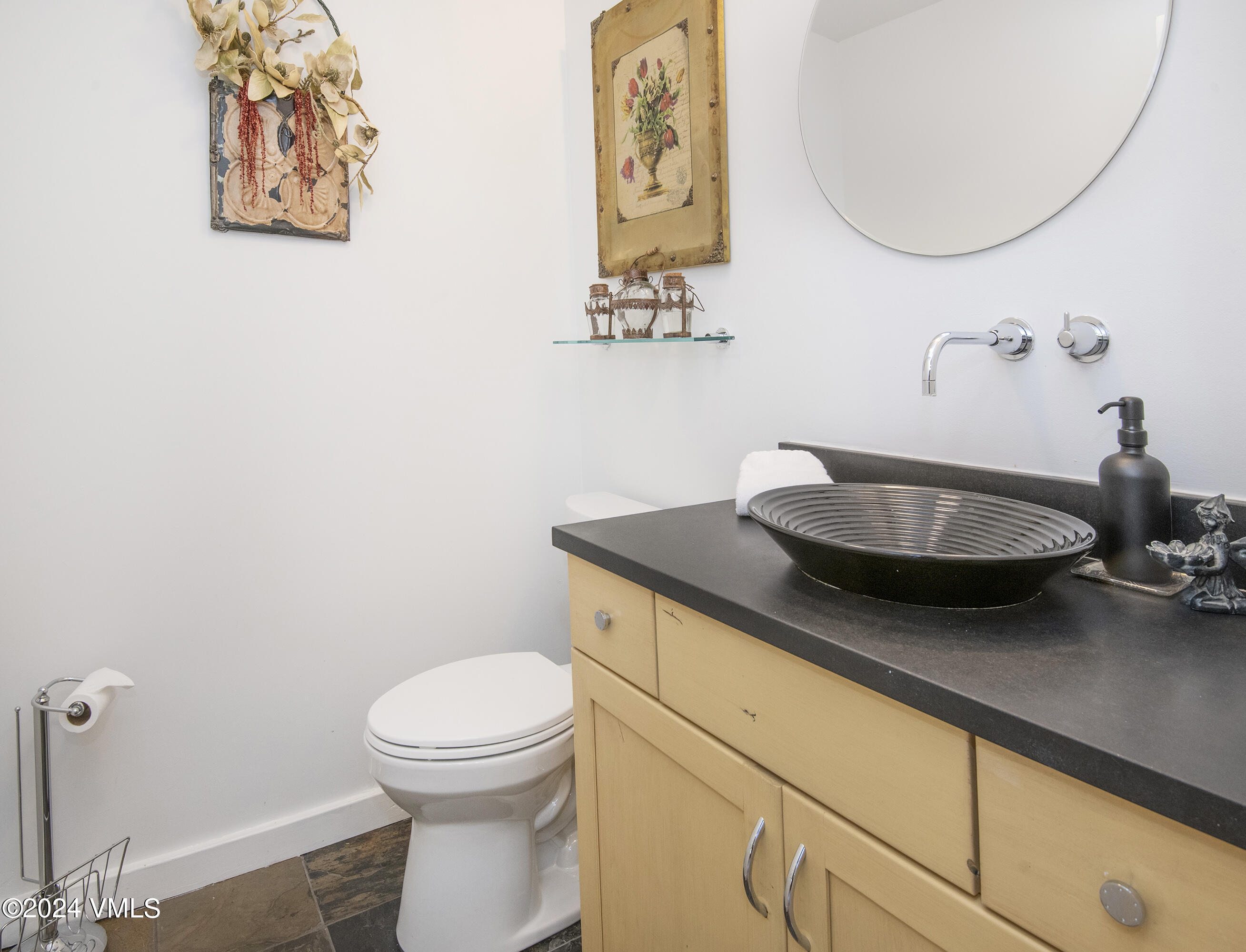 1968 Vermont Road Vail, CO 81657 - Photo 20 of 69 a bathroom with a toilet and a mirror