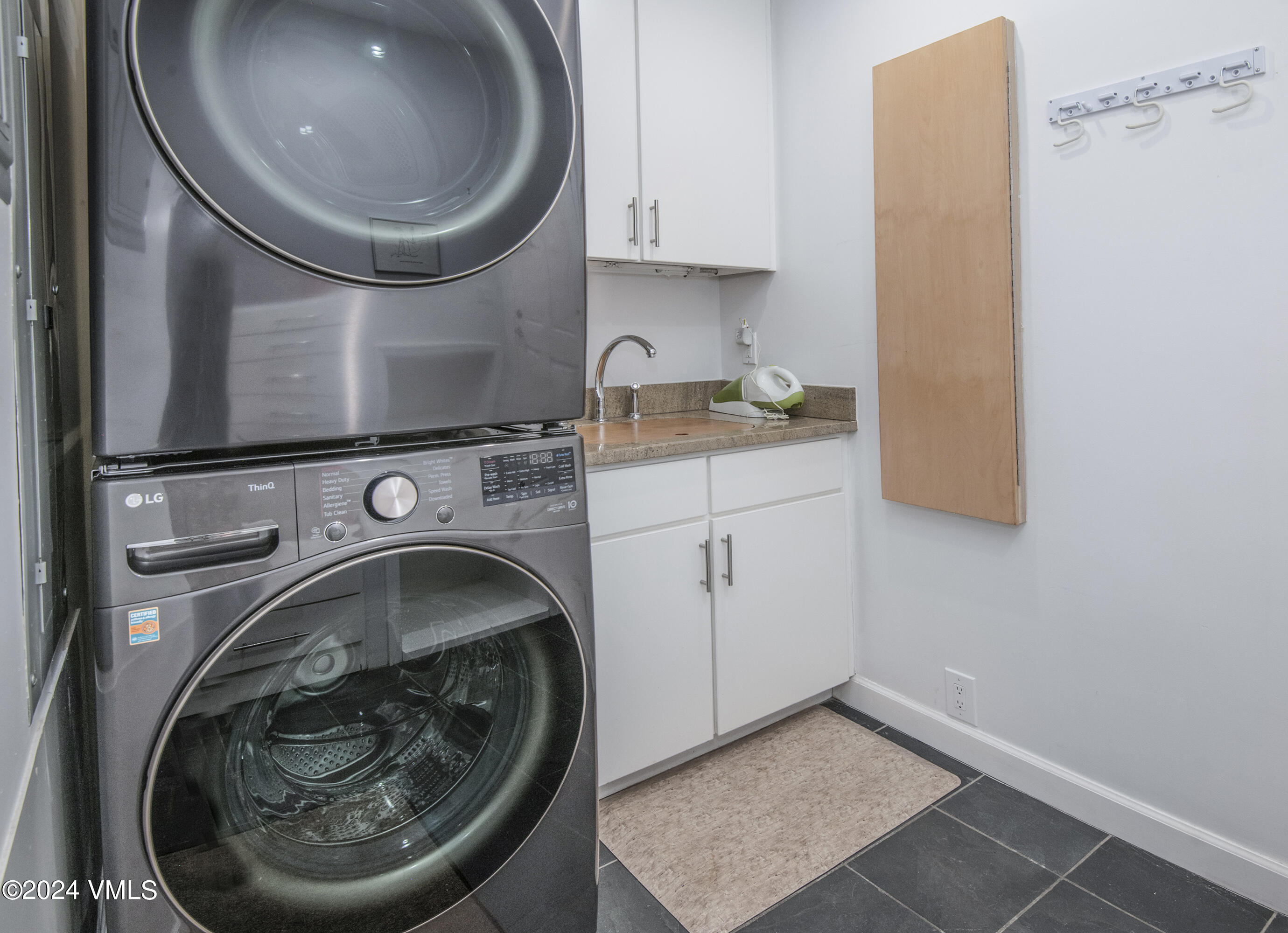 1968 Vermont Road Vail, CO 81657 - Photo 21 of 69 a utility room with sink dryer and washer