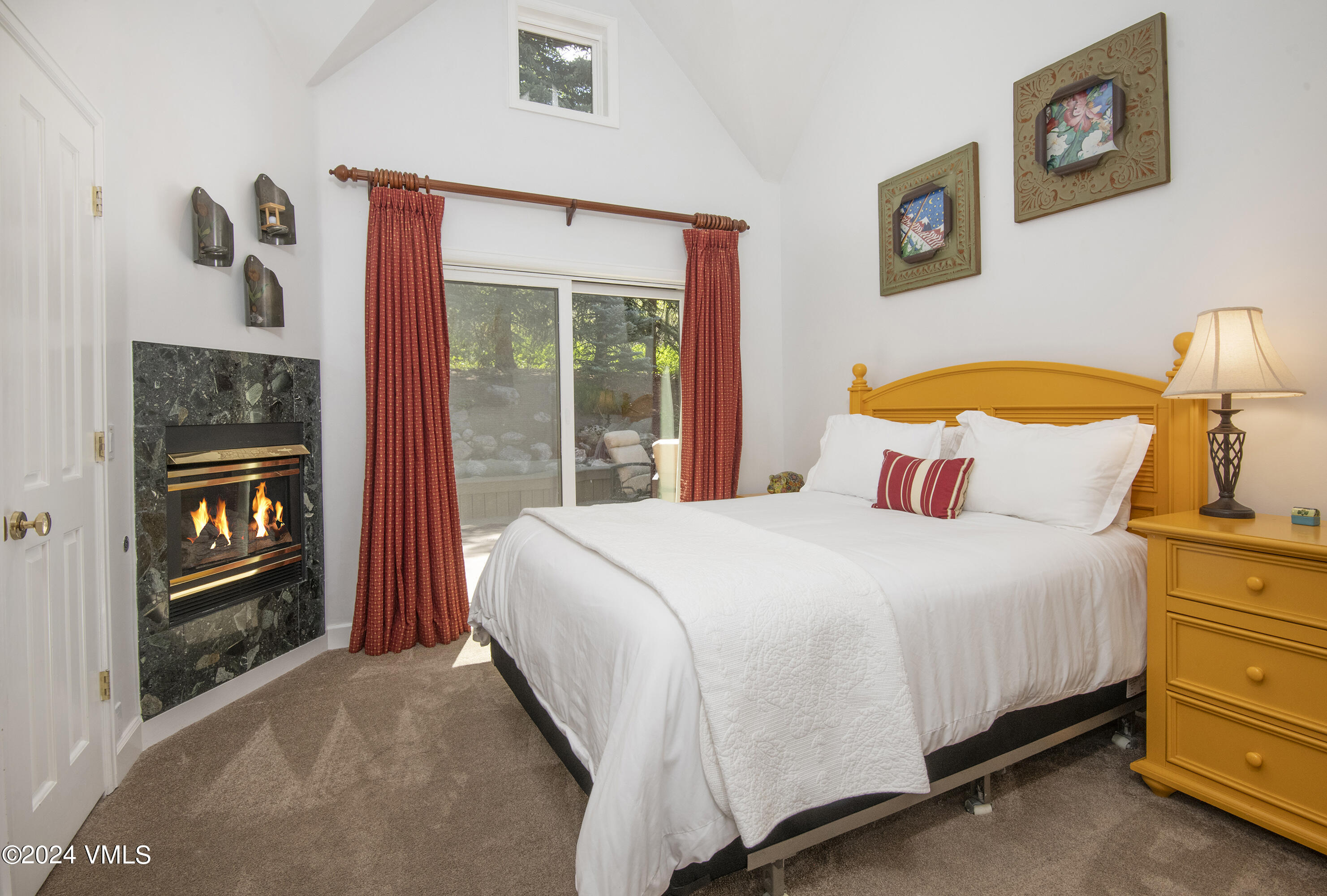 1968 Vermont Road Vail, CO 81657 - Photo 36 of 69 a bedroom with a bed and a lamp on dresser