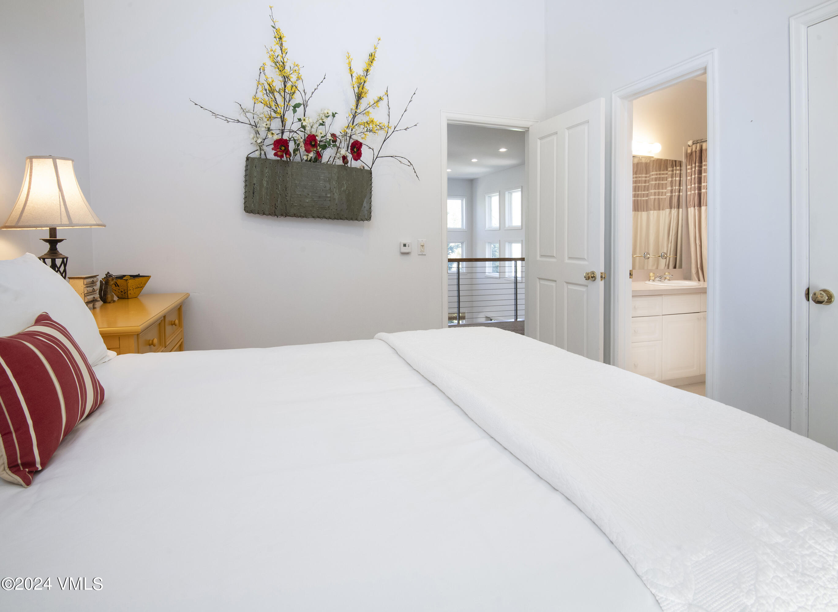 1968 Vermont Road Vail, CO 81657 - Photo 37 of 69 a bedroom with a bed and a flat screen tv