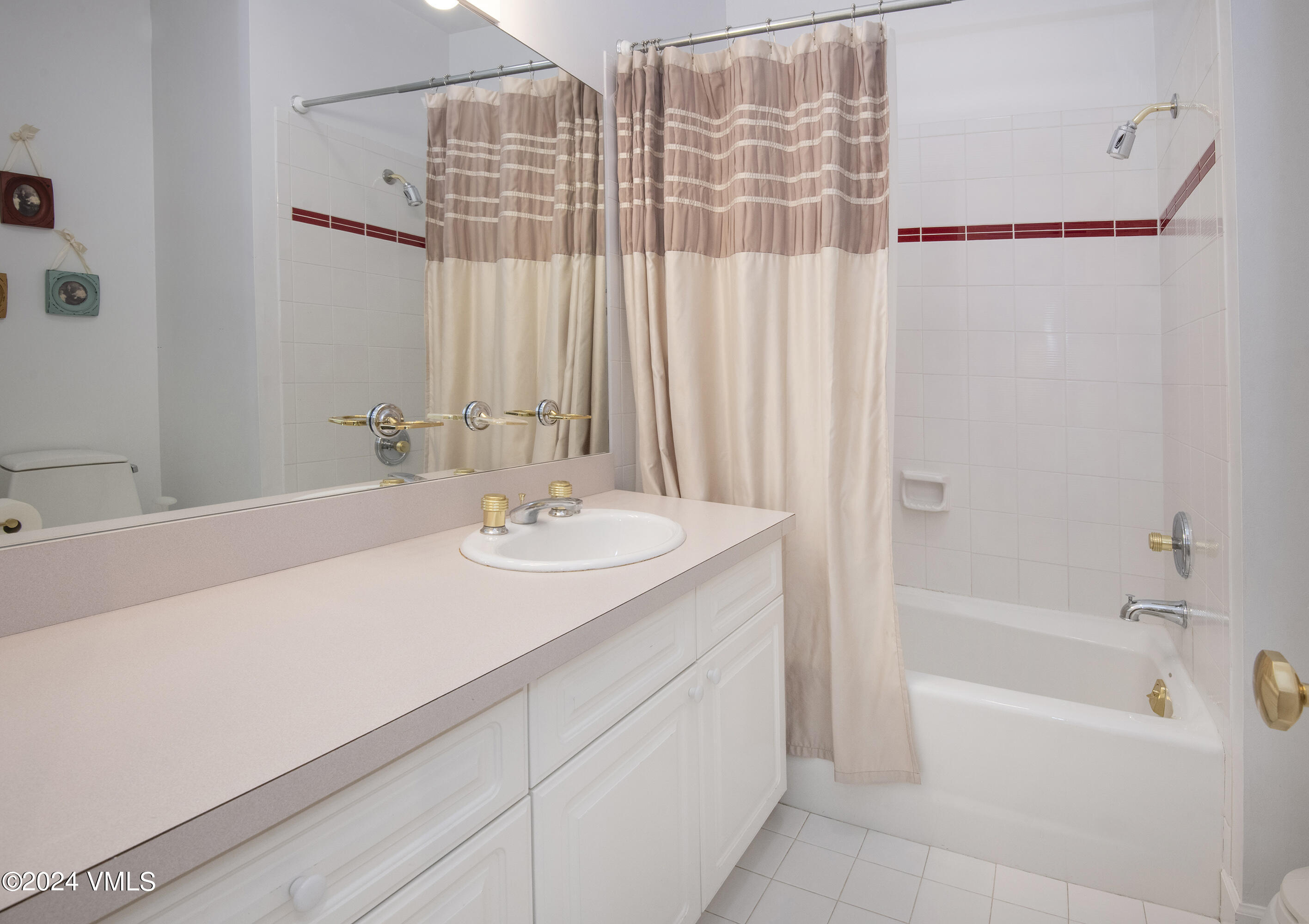 1968 Vermont Road Vail, CO 81657 - Photo 38 of 69 a bathroom with a sink and a mirror