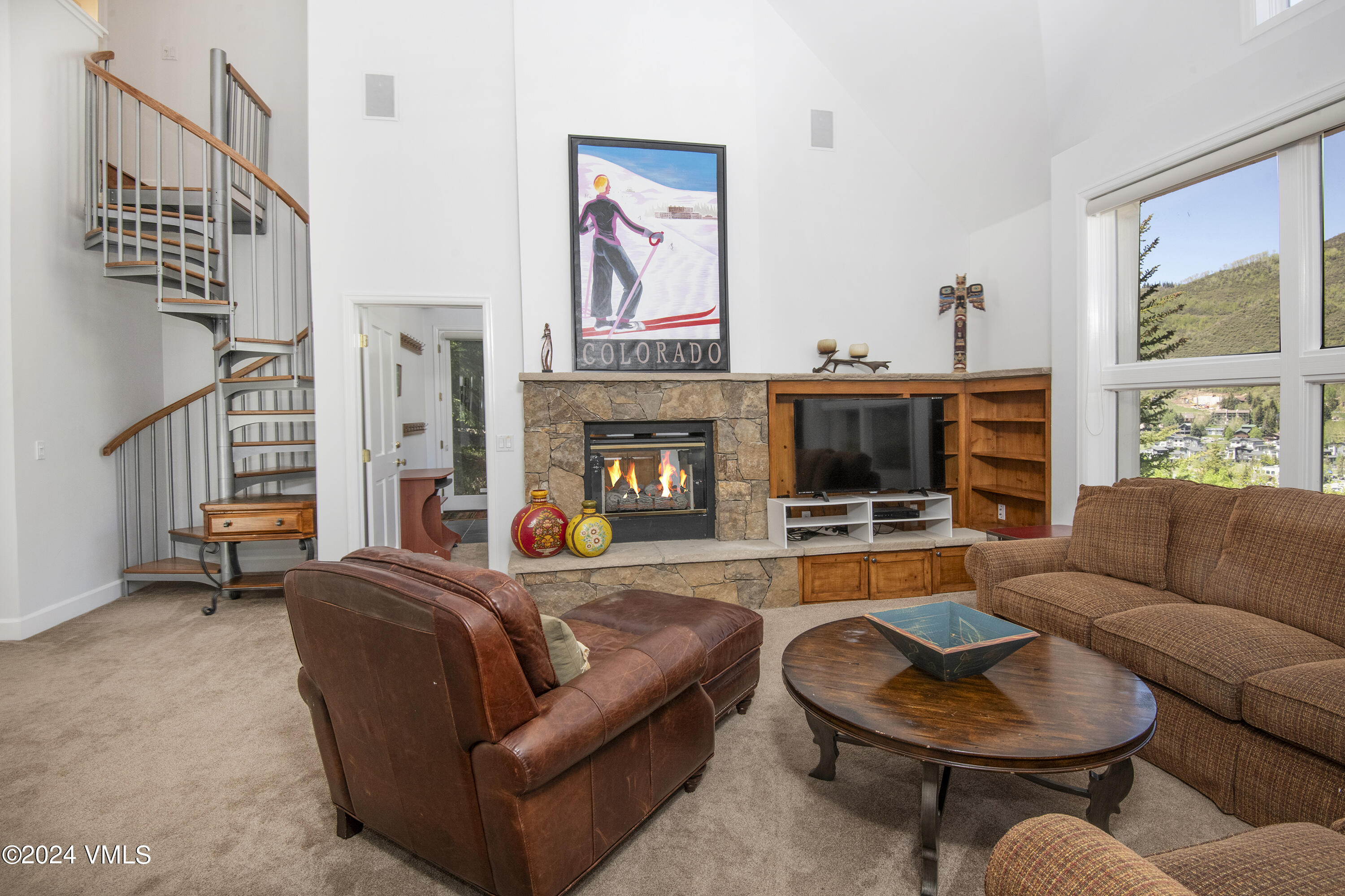 1968 Vermont Road Vail, CO 81657 - Photo 39 of 69 a living room with fireplace furniture and a flat screen tv