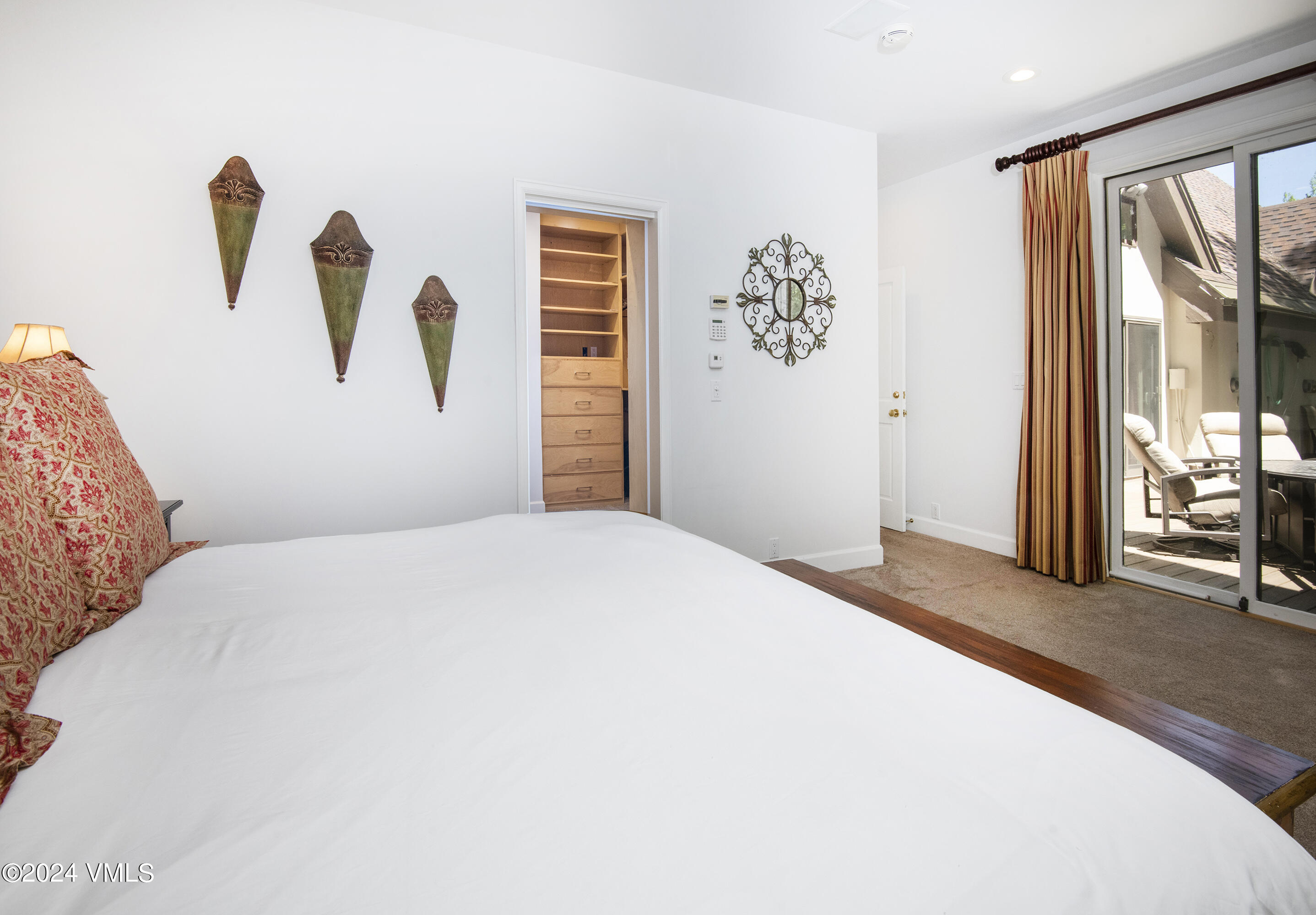 1968 Vermont Road Vail, CO 81657 - Photo 44 of 69 a bedroom with a large bed and a large window