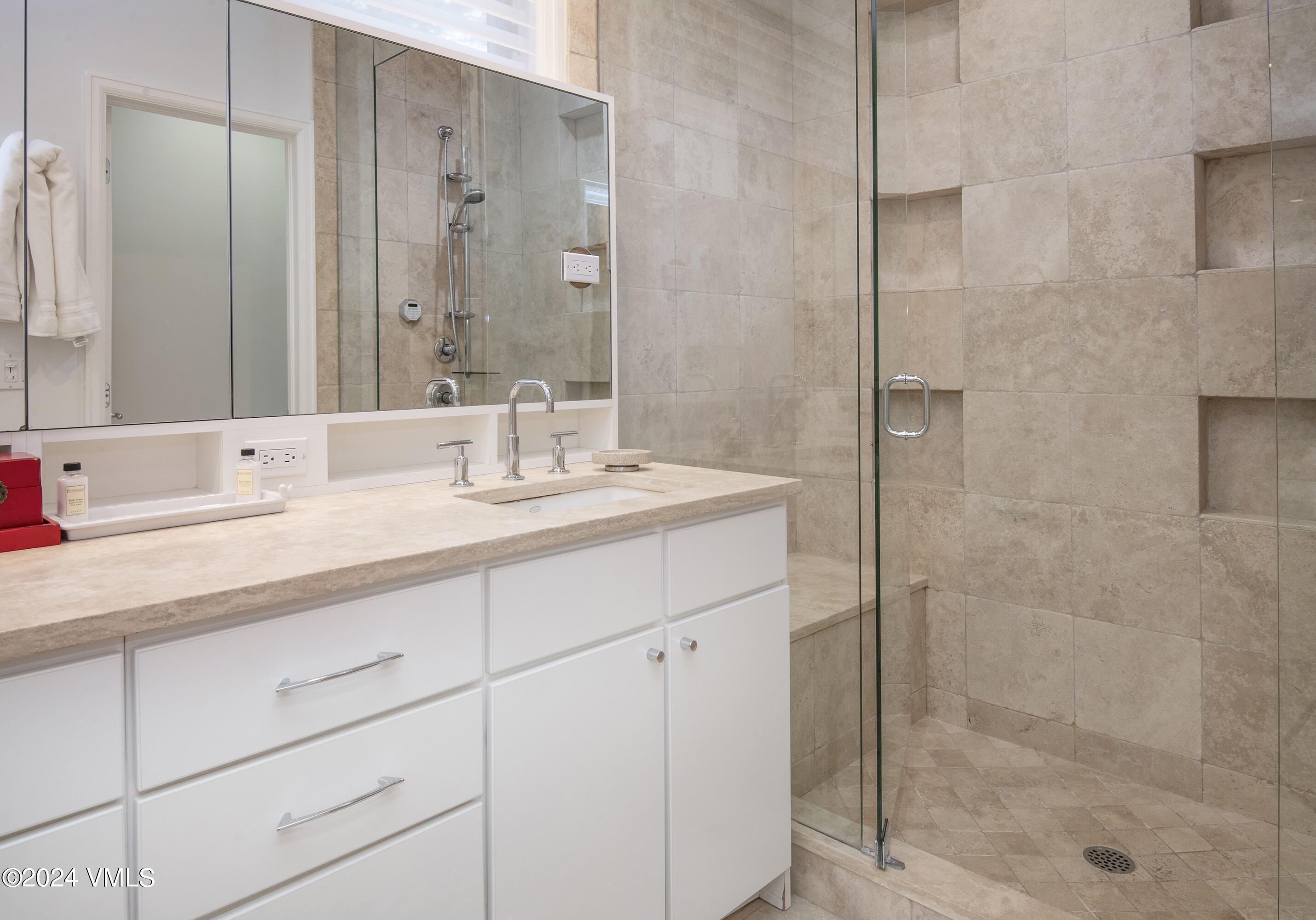 1968 Vermont Road Vail, CO 81657 - Photo 46 of 69 a bathroom with a shower sink and mirror