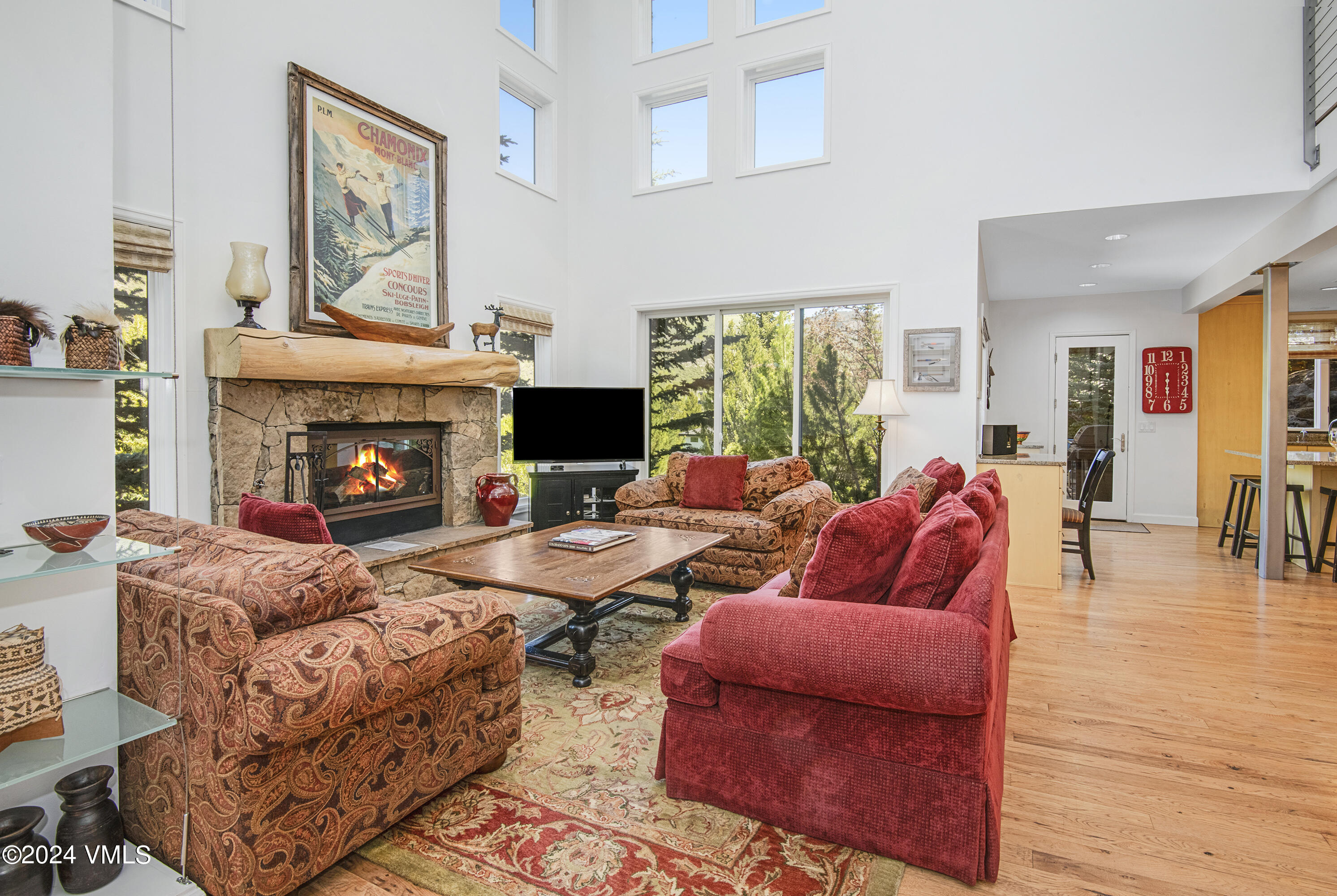 1968 Vermont Road Vail, CO 81657 - Photo 5 of 69 a living room with furniture fireplace and a large window