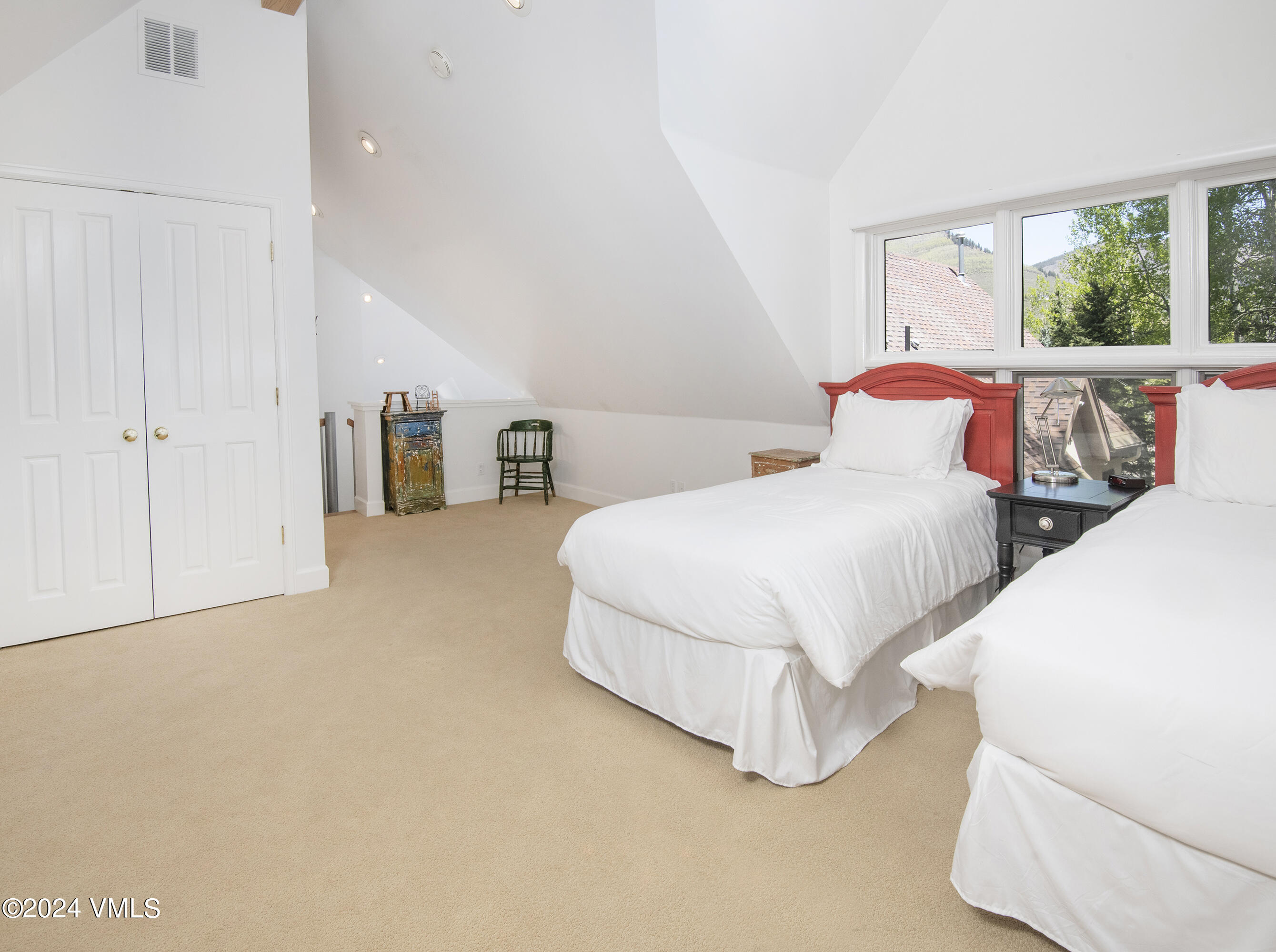 1968 Vermont Road Vail, CO 81657 - Photo 51 of 69 a bedroom with two beds and large windows