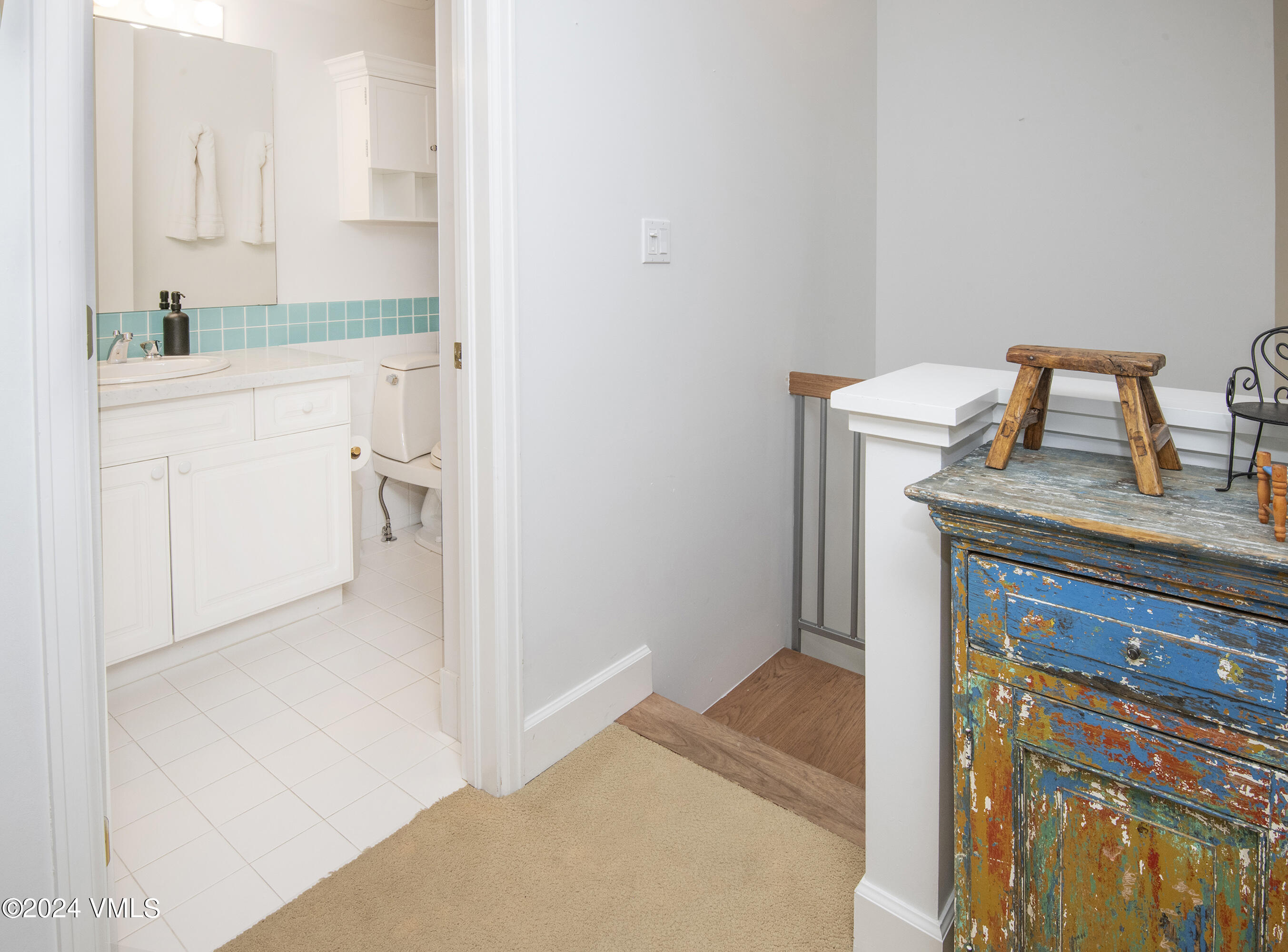 1968 Vermont Road Vail, CO 81657 - Photo 52 of 69 a en suite bathroom with a granite countertop sink and a mirror