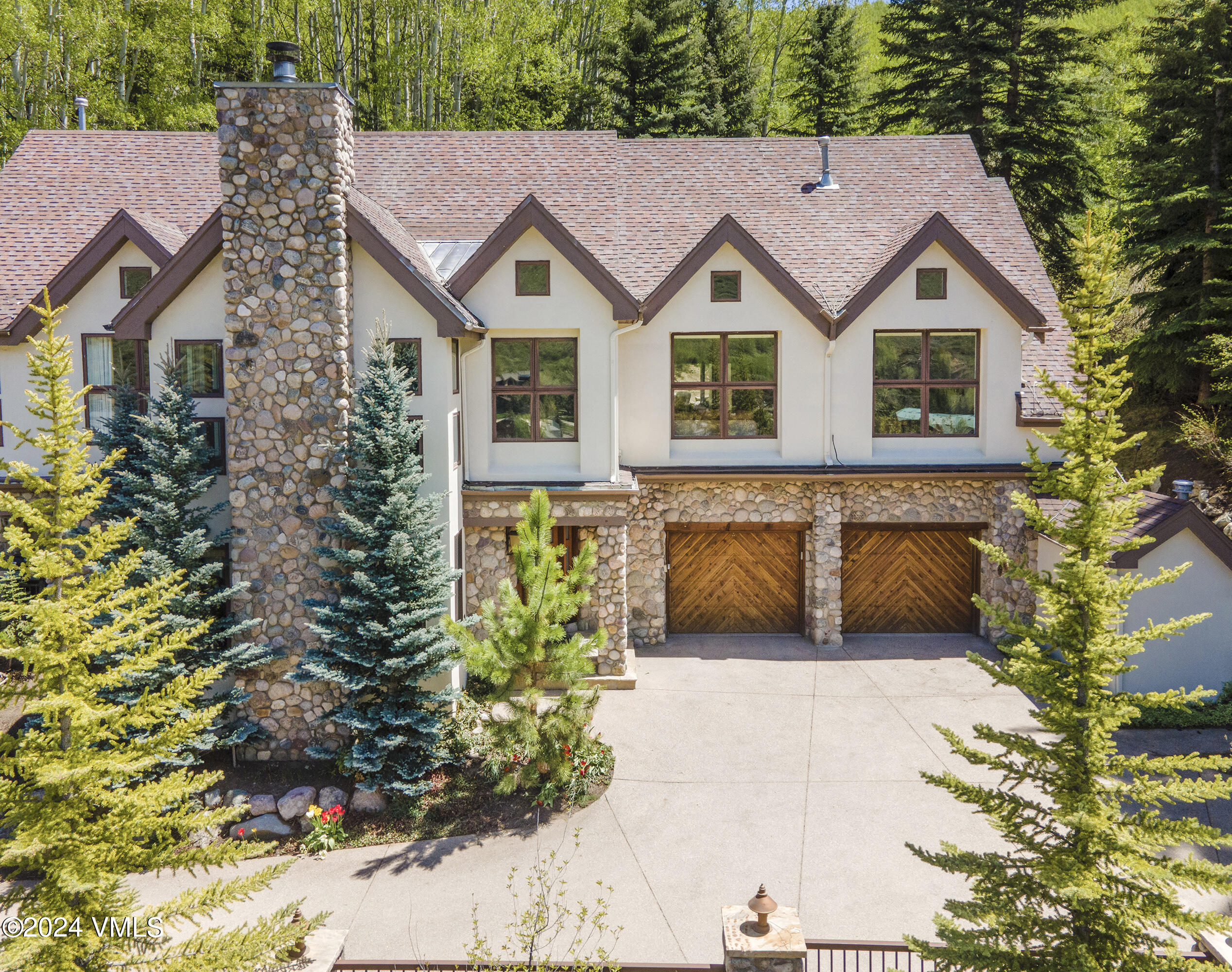 1968 Vermont Road Vail, CO 81657 - Photo 68 of 69 a view of a house with a yard and garden
