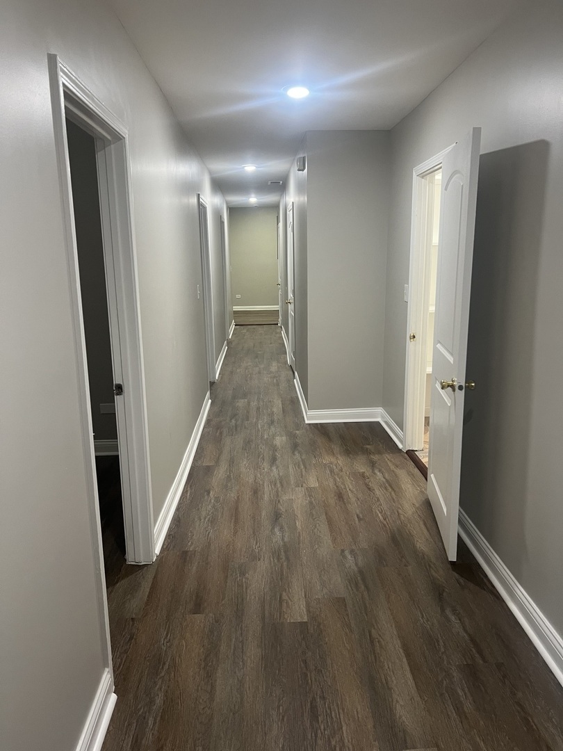 1434 South St Louis Avenue, Unit 1 Chicago, IL 60623 - Photo 6 of 9 wooden floor in an empty room with wooden floor