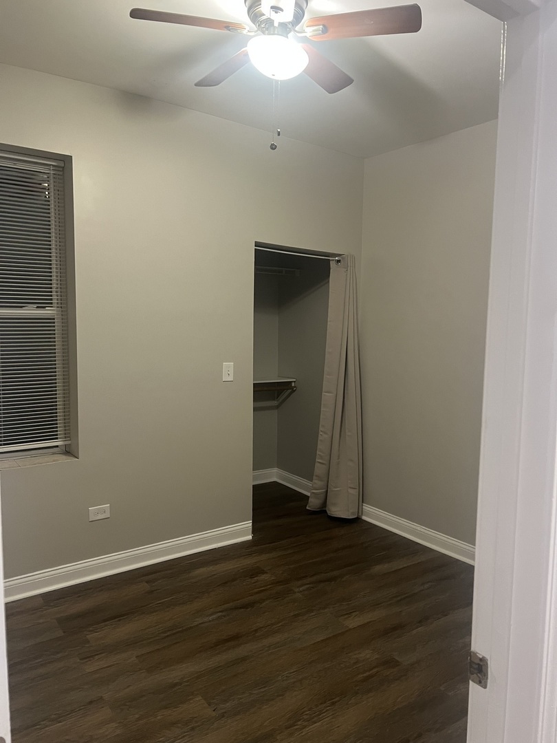 1434 South St Louis Avenue, Unit 1 Chicago, IL 60623 - Photo 9 of 9 wooden floor in an empty room