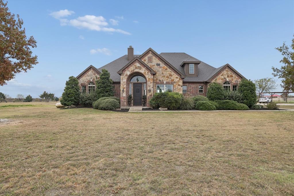 542 Pierce Road Red Oak, TX 75154 - Photo 2 of 40 a house with a field in front of it