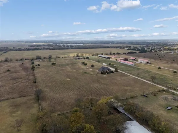 a view of a lake with lawn chairs