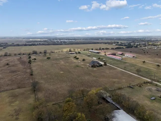 a view of a lake with lawn chairs