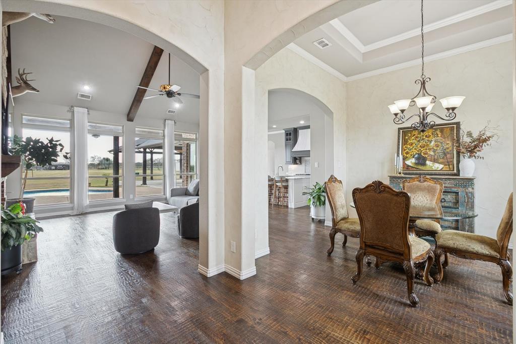 542 Pierce Road Red Oak, TX 75154 - Photo 5 of 40 a living room with furniture and a chandelier