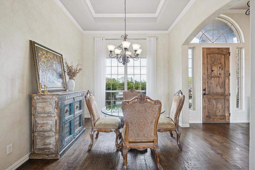 542 Pierce Road Red Oak, TX 75154 - Photo 8 of 40 a dining room with furniture a chandelier and wooden floor