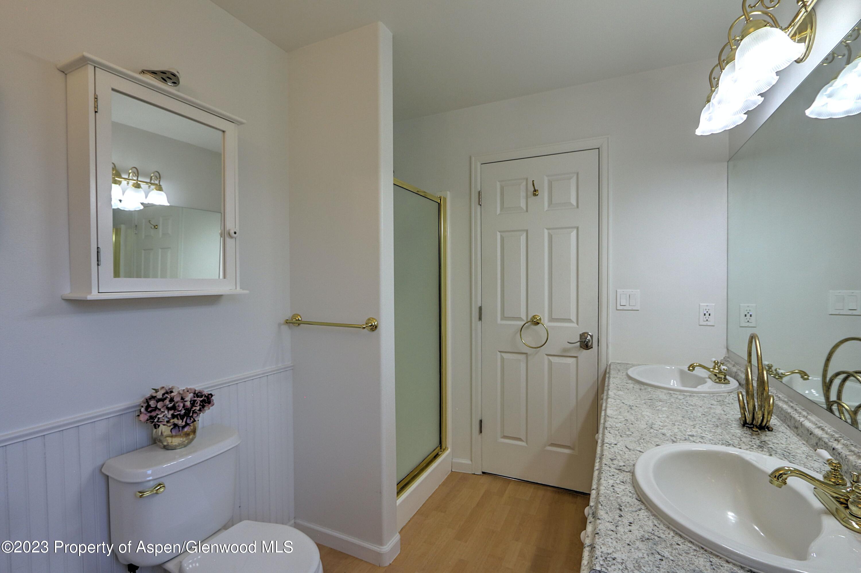1527 Graham Court Rifle, CO 81650 - Photo 21 of 32 a bathroom with a sink toilet and shower